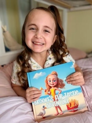 Happy child with personalized book open